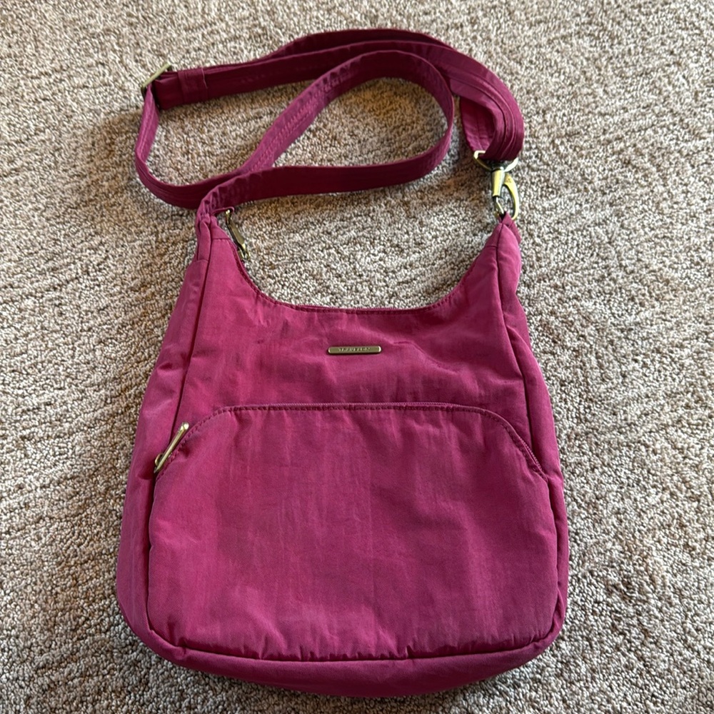 Travelon Crossbody purse dark berry color.